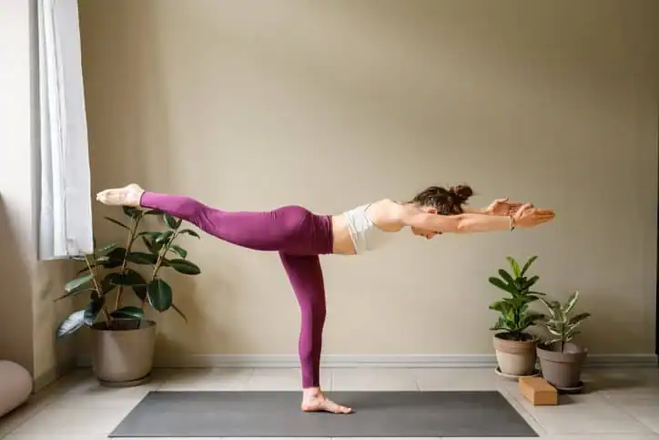 Woman doing Yoga exercise Hertfordshire to help with toning the body. 