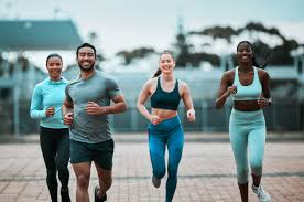 Sculpting Sleek Arms: The Essential Role of Cardio in Toning Without Bulking Up 3 image of people running to incorporate cardio Hertfordshire exercise into their life to help tone arms and body.
