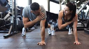 Sculpting Sleek Arms: The Essential Role of Cardio in Toning Without Bulking Up 1 Image of man and woman doing Cardio Hertfordshire to tone their arms.